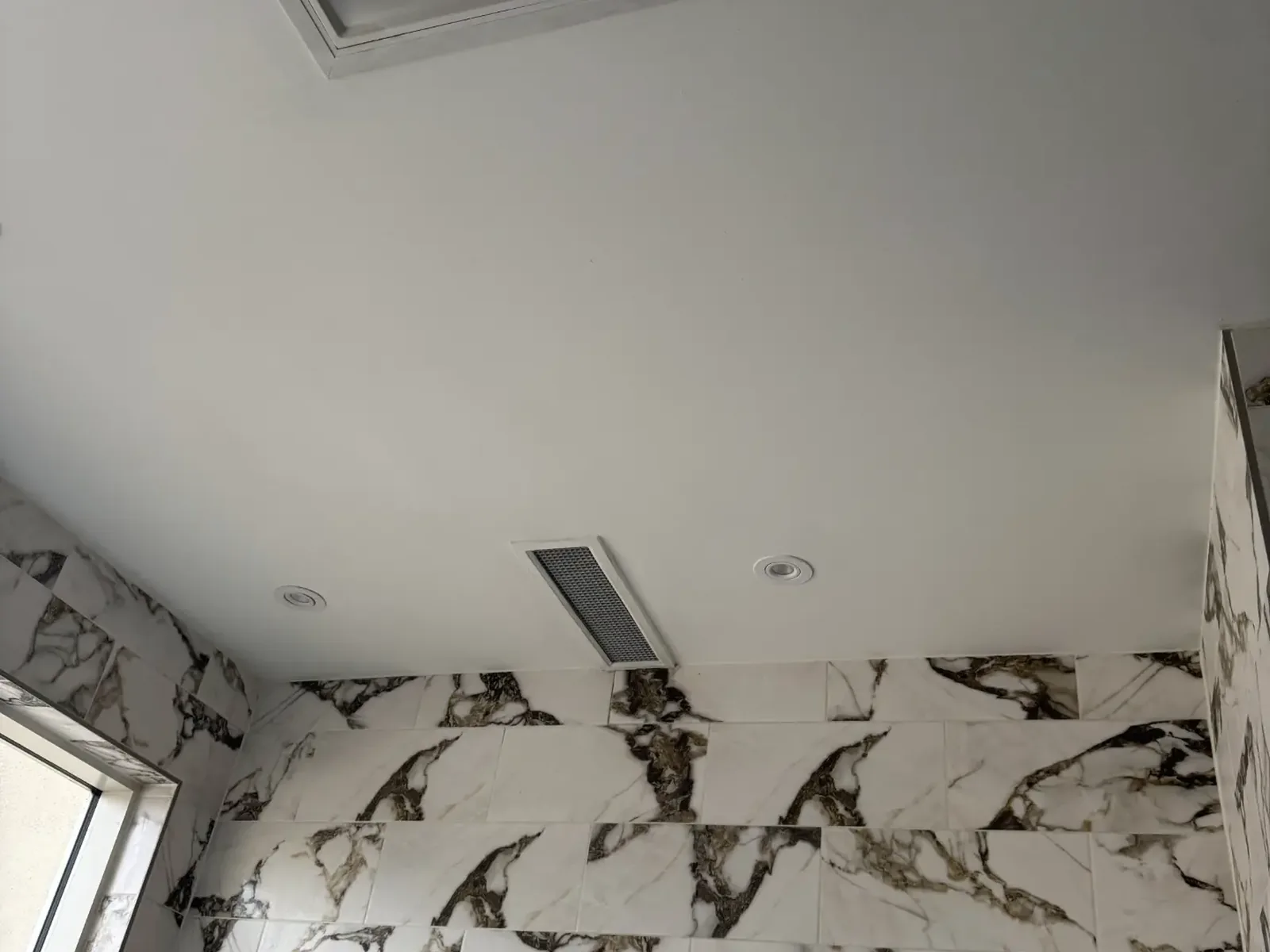 Ceiling repaired, taped and finished around the HVAC vent