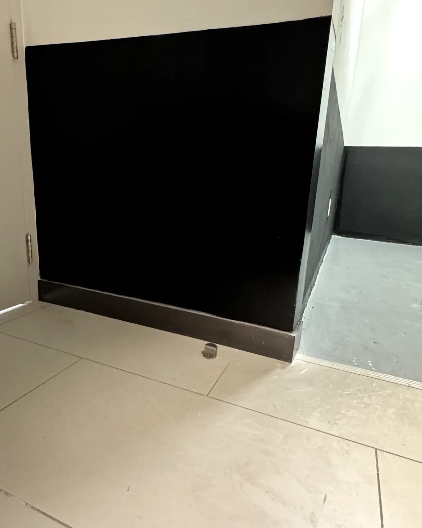 Apartment corridor wall patched and repainted after drywall repair
